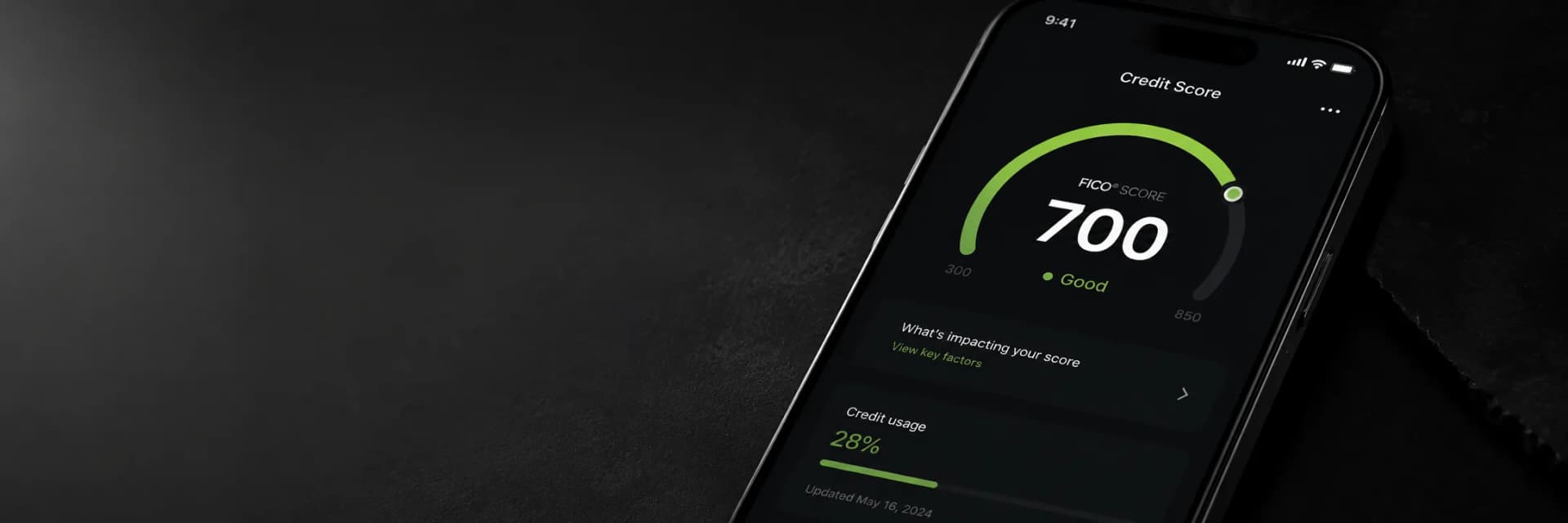 Phone showing a rebuilt 700 credit score